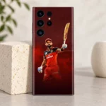 Virat Kohli raised-bat photo mobile skin in red and black, bright limestone studio