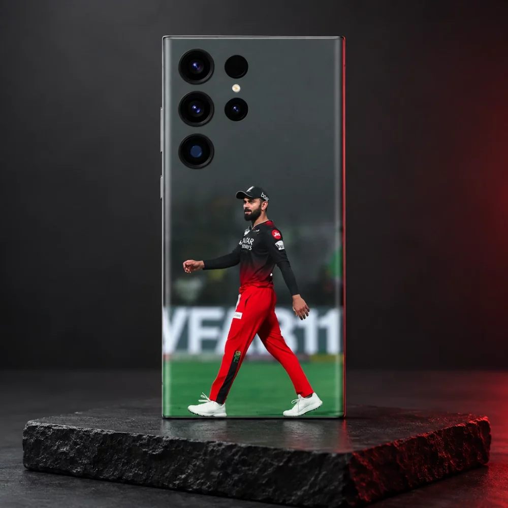 Virat Kohli walking in red and black cricket kit on a phone skin, slate studio hero