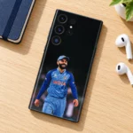 Virat Kohli smiling India photo mobile skin, oak desk flat lay