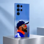Virat Kohli Photo Mobile Skin featuring a side portrait with mirrored sunglasses and orange collar, silver studio view