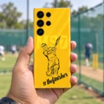 Yellow Dhoni batting illustration mobile skin with thefinisher script, practice nets handheld view