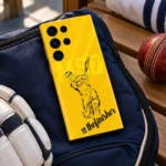 Yellow Dhoni batting illustration mobile skin with thefinisher script, kit bag detail