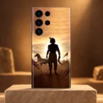 Krishna Sunset Silhouette Mobile Skin with horse and chariot artwork on a sandstone pedestal