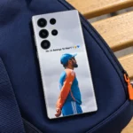 Virat Kohli mobile skin with No.18 Belongs To Heart message and blue-orange training portrait, navy sports bag