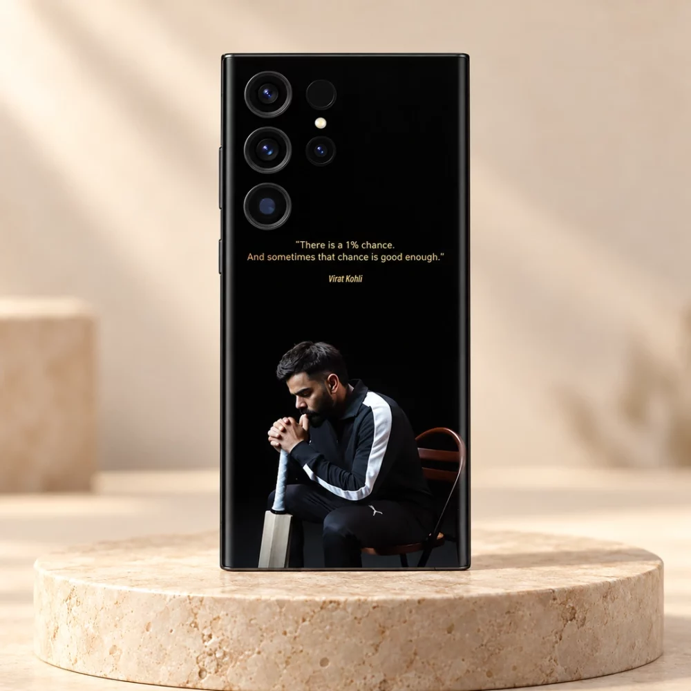 Black Virat Kohli mobile skin with gold 1% chance quote and seated portrait, stone studio hero
