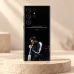 Black Virat Kohli mobile skin with gold 1% chance quote and seated portrait, stone studio hero