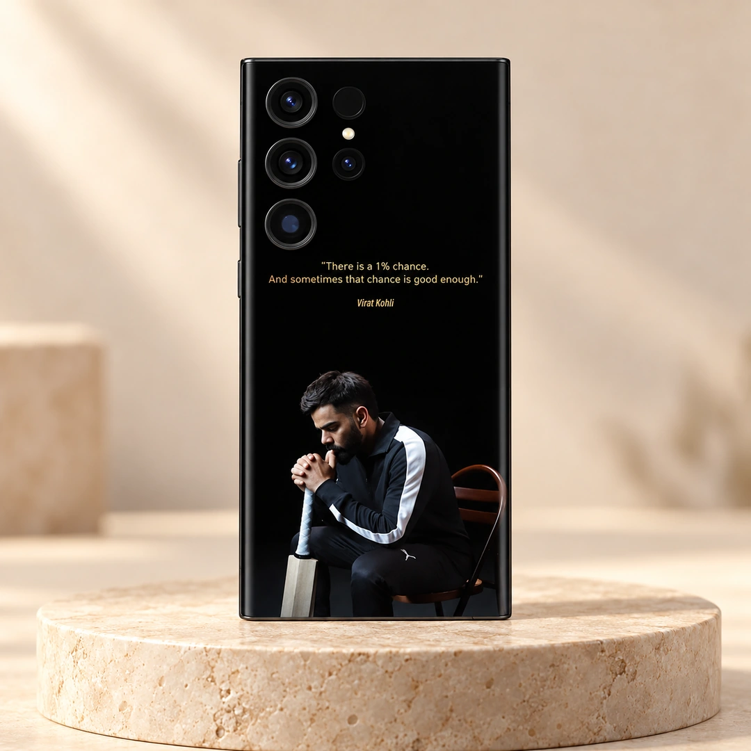Virat Kohli 1% Chance Quote Mobile Skin - Stone Studio Hero Black Virat Kohli mobile skin with gold 1% chance quote and seated portrait, stone studio hero