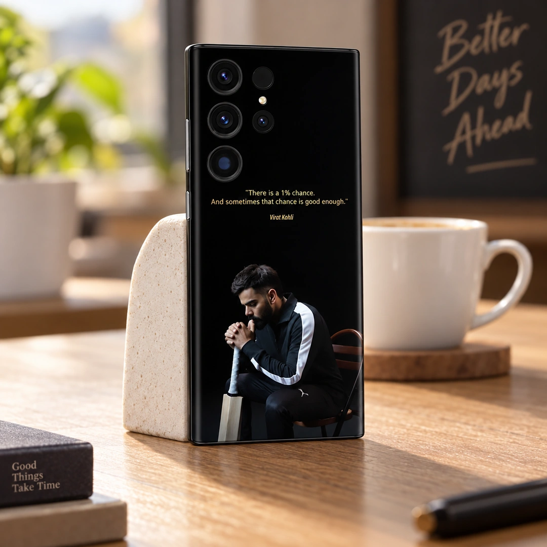 Virat Kohli 1% Chance Quote Mobile Skin - Cafe Lifestyle Black Virat Kohli mobile skin with gold 1% chance quote and seated portrait, cafe lifestyle