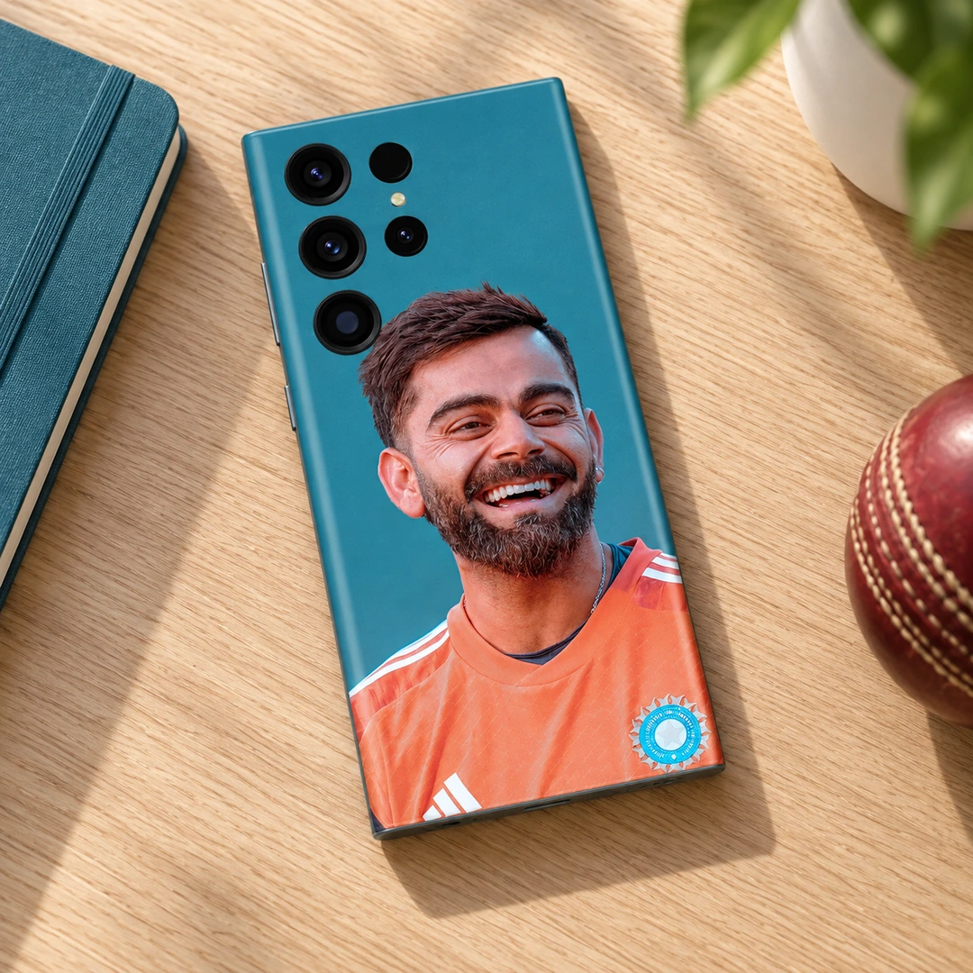 Virat Kohli Smiling Portrait Mobile Skin - Cricket Fan Desk Virat Kohli smiling in an orange training shirt on a teal mobile skin, cricket fan desk