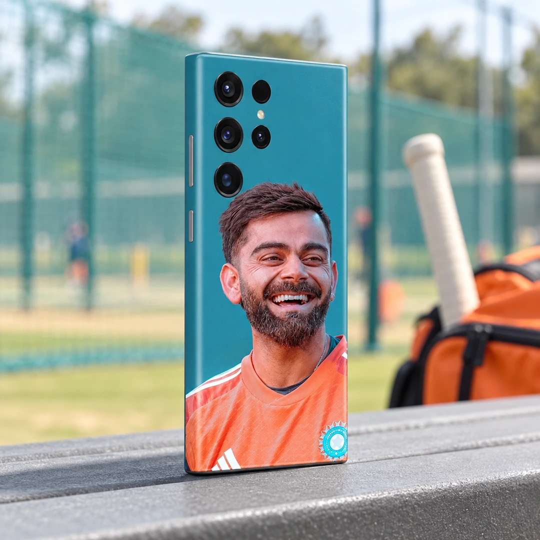 Virat Kohli Smiling Portrait Mobile Skin - Practice Pavilion Virat Kohli smiling in an orange training shirt on a teal mobile skin, practice pavilion