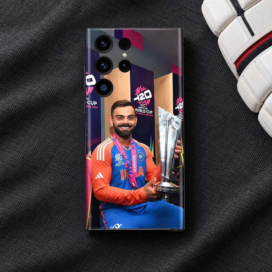 Virat Kohli T20 Trophy Mobile Skin – studio fabric Virat Kohli trophy photo mobile skin on charcoal fabric beside a cricket glove