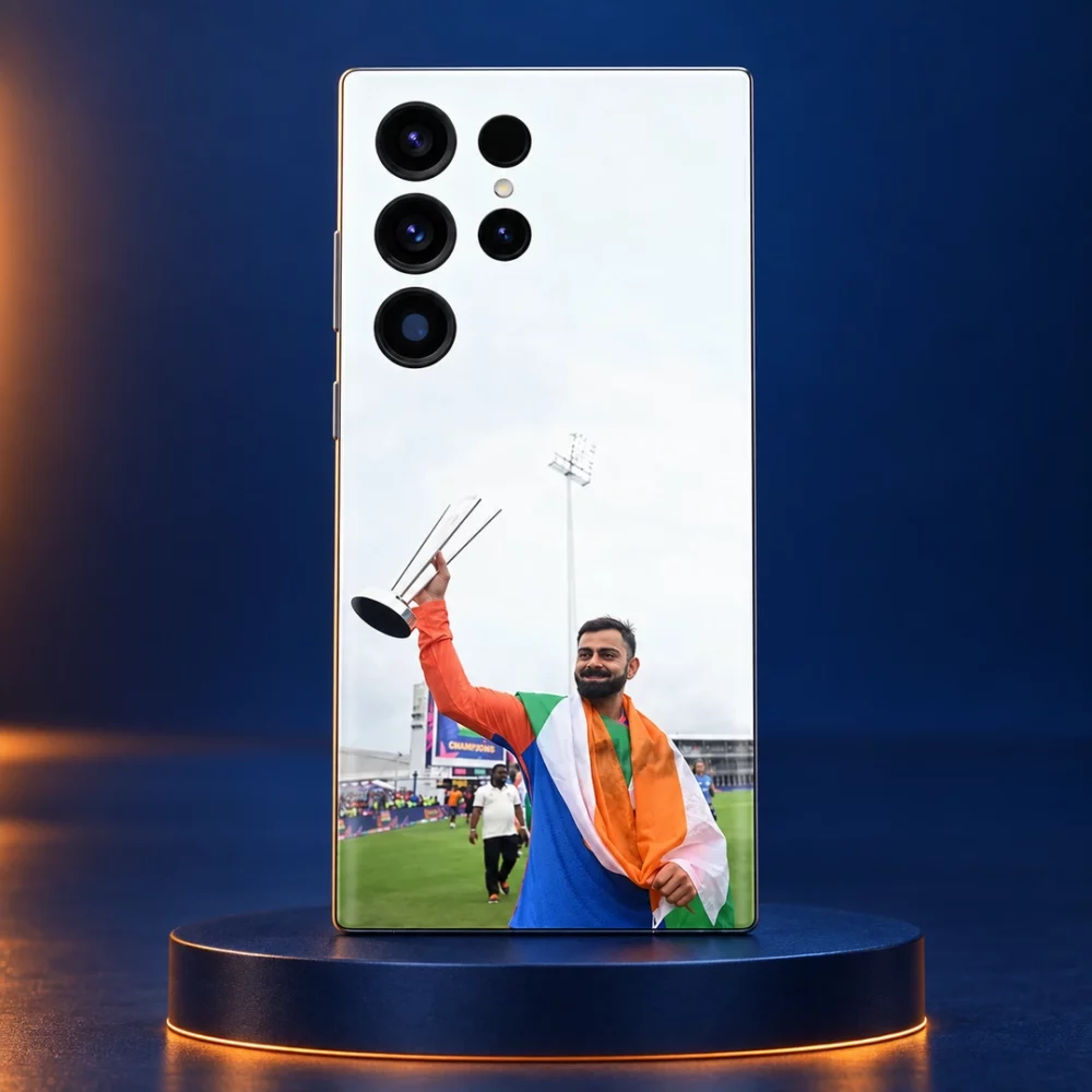 Virat Kohli raising a silver trophy while draped in the Indian tricolour on a mobile skin, navy podium hero