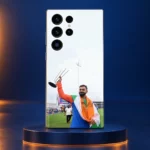 Virat Kohli raising a silver trophy while draped in the Indian tricolour on a mobile skin, navy podium hero