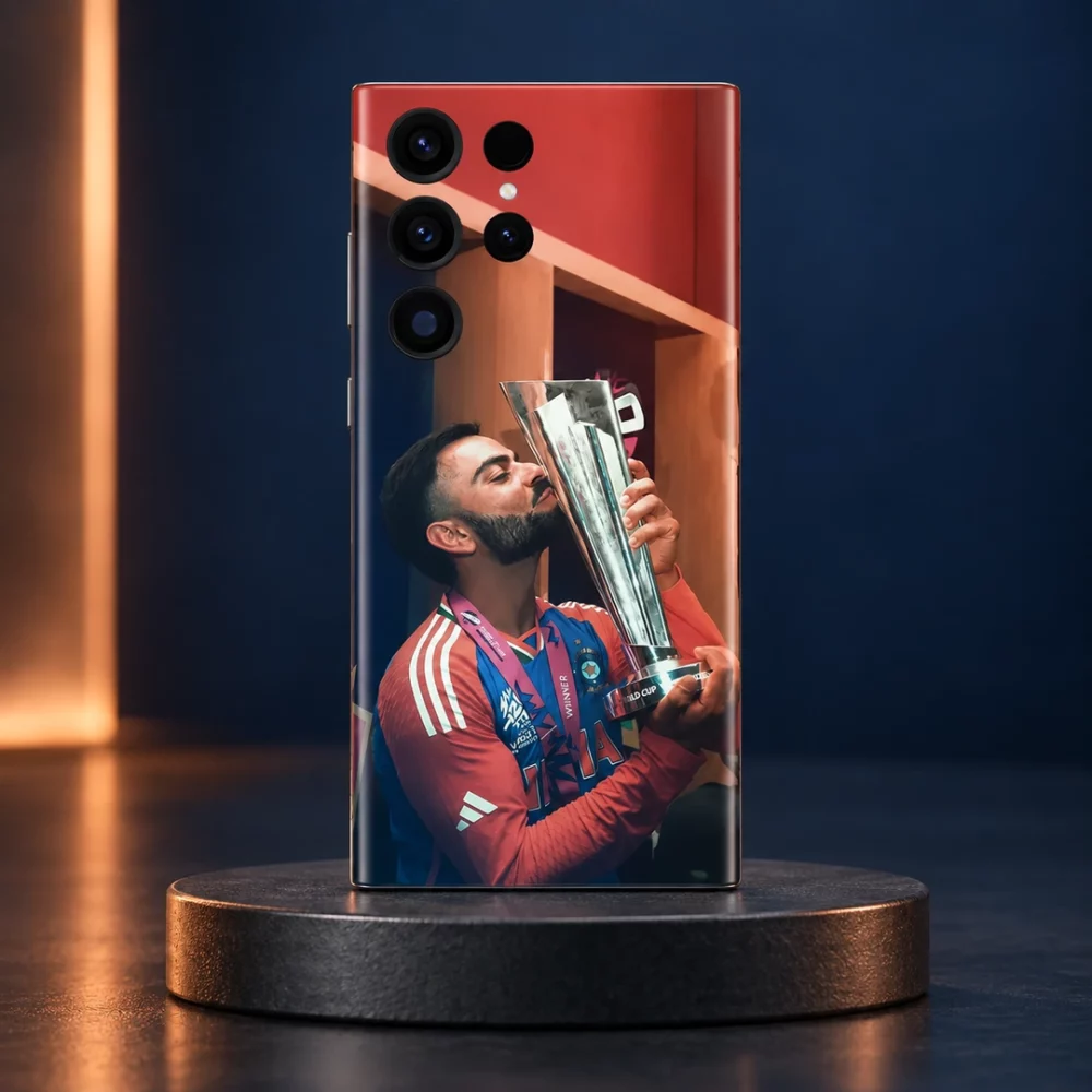 Virat Kohli kissing a silver cricket trophy on a phone skin, navy studio hero