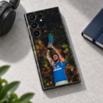 Virat Kohli trophy celebration photo mobile skin with blue and orange shirt, minimal stone desk view