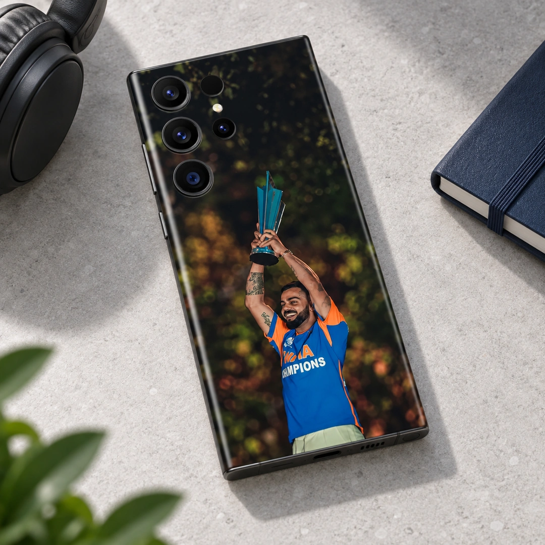 Virat Kohli Trophy Celebration Mobile Skin – Minimal Stone Desk View Virat Kohli trophy celebration photo mobile skin with blue and orange shirt, minimal stone desk view