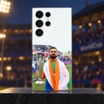 Virat Kohli trophy mobile skin standing on a charcoal plinth in a softly lit cricket pavilion