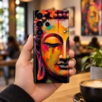 Buddha colourful painting mobile skin held in a modern gallery cafe