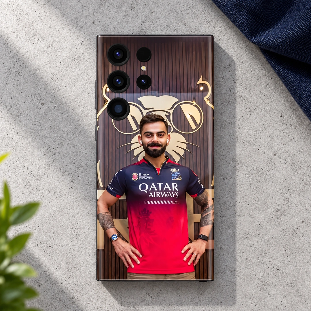 Virat Kohli Red Jersey Portrait Mobile Skin – Light concrete flat lay Virat Kohli mobile skin with red jersey portrait and gold lion backdrop, light concrete flat lay