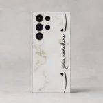 Elegant Marble Customized Name Mobile Skin — rear view showing cream marble with black hearts and custom cursive name