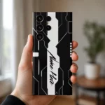 Futuristic Tech Customized Name Mobile Skin — in hand showing black and white circuit inspired artwork with a central white name stripe