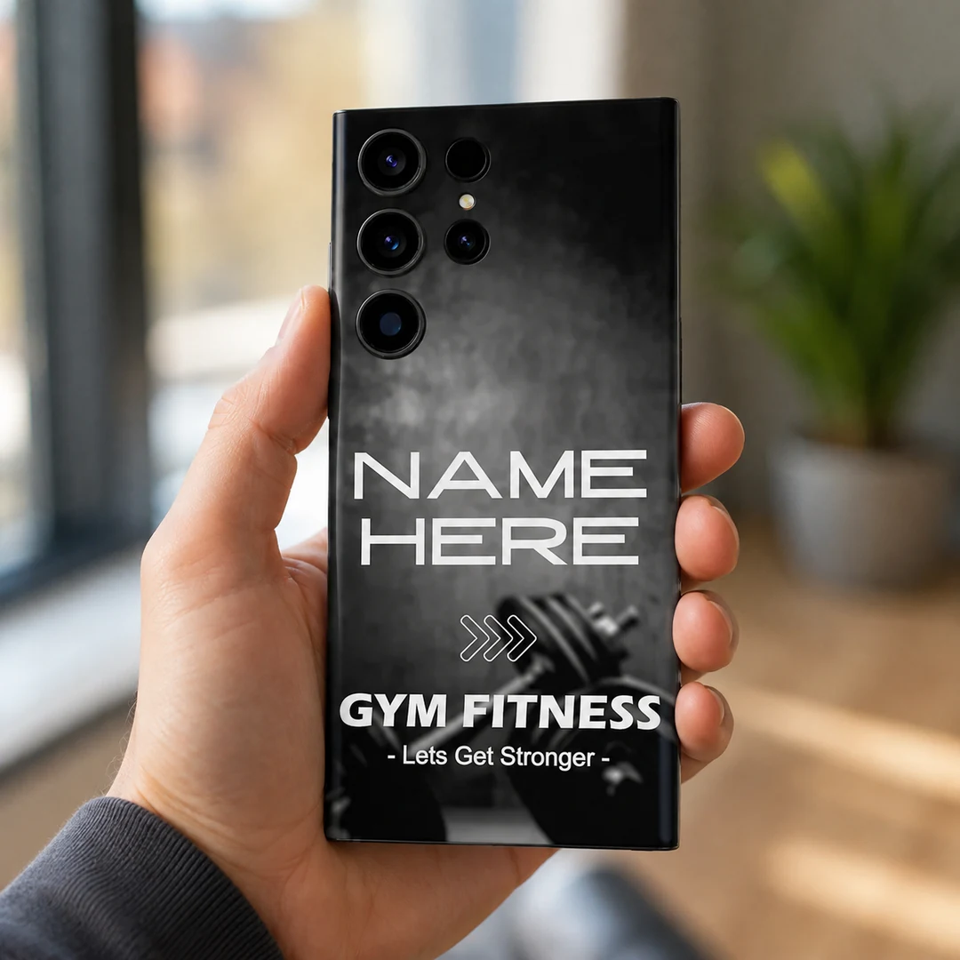 Gym Fitness Customized Name Mobile Skin - in hand Gym Fitness Customized Name Mobile Skin — in hand showing black and grey dumbbell artwork with Gym Fitness lettering and sample name