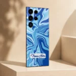 Ocean Wave Abstract Customized Name Mobile Skin — angled view showing cyan and cobalt flowing waves with a white brushstroke sample name label