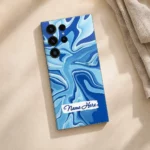 Ocean Wave Abstract Customized Name Mobile Skin — flat lay showing cyan and cobalt flowing waves with a white brushstroke sample name label