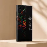 Royal Floral Glow Customized Name Mobile Skin — angled view showing colourful floral scrollwork on black with vertical white cursive sample name