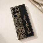 Royal Mandala Customized Name Mobile Skin — flat lay showing the black and gold mandala design with gold cursive sample name