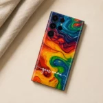 Vibrant Galaxy Customized Name Mobile Skin — flat lay showing vibrant rainbow swirling abstract artwork with white cursive sample name