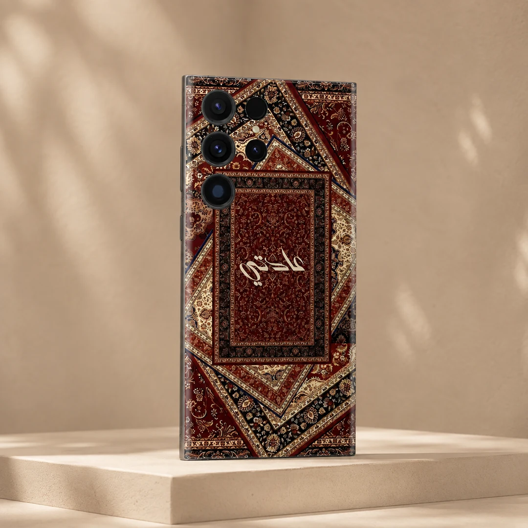 Sultan’s Grace Custom Name Mobile Skin - angled view Sultan’s Grace Custom Name Mobile Skin — angled view showing burgundy, cream and black Persian rug motifs with central cream calligraphy