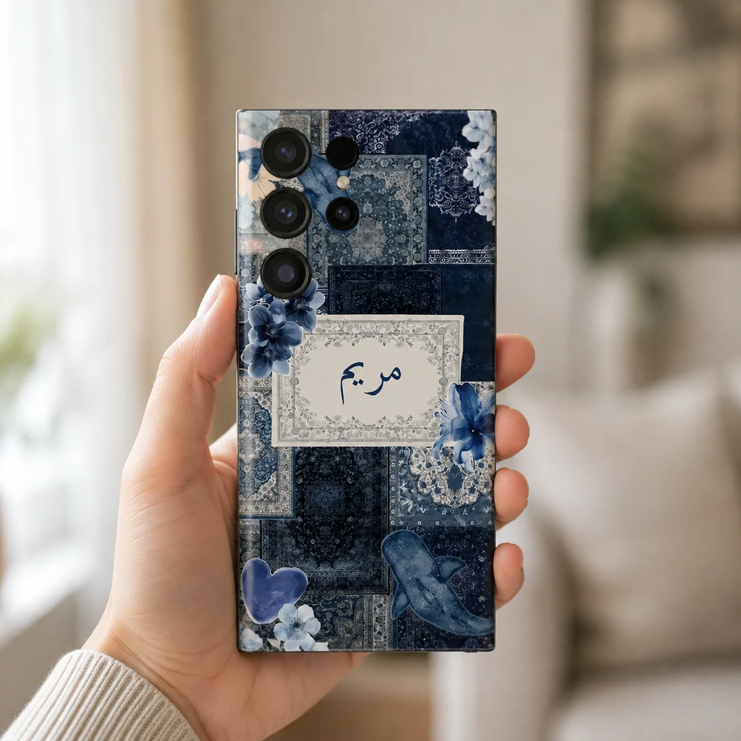 Velvet Persia Custom Name Mobile Skin - in hand Velvet Persia Custom Name Mobile Skin — in hand showing navy Persian patterns, blue flowers and a cream custom name panel