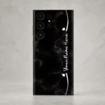 Black Marble Custom Name Mobile Skin — rear view showing black marble with subtle grey veins, white hearts and cursive sample name