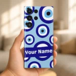 Hand holding a phone with blue Evil Eye Custom Name Mobile Skin and a white Your Name inscription