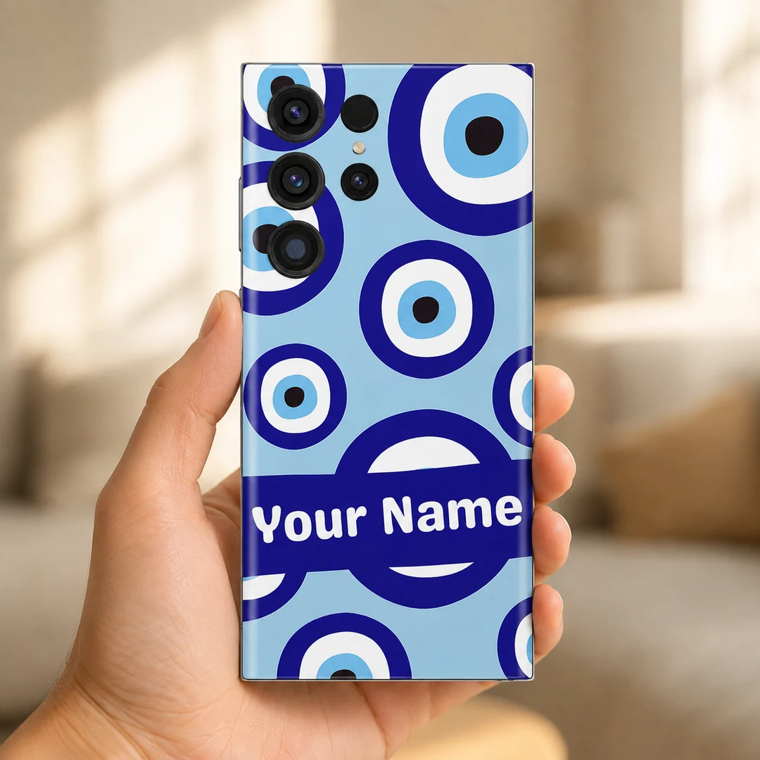 Evil Eye Custom Name Mobile Skin - In Hand Hand holding a phone with blue Evil Eye Custom Name Mobile Skin and a white Your Name inscription