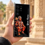 Lord Hanuman Gada Custom Name Mobile Skin held in hand against sunlit sandstone architecture