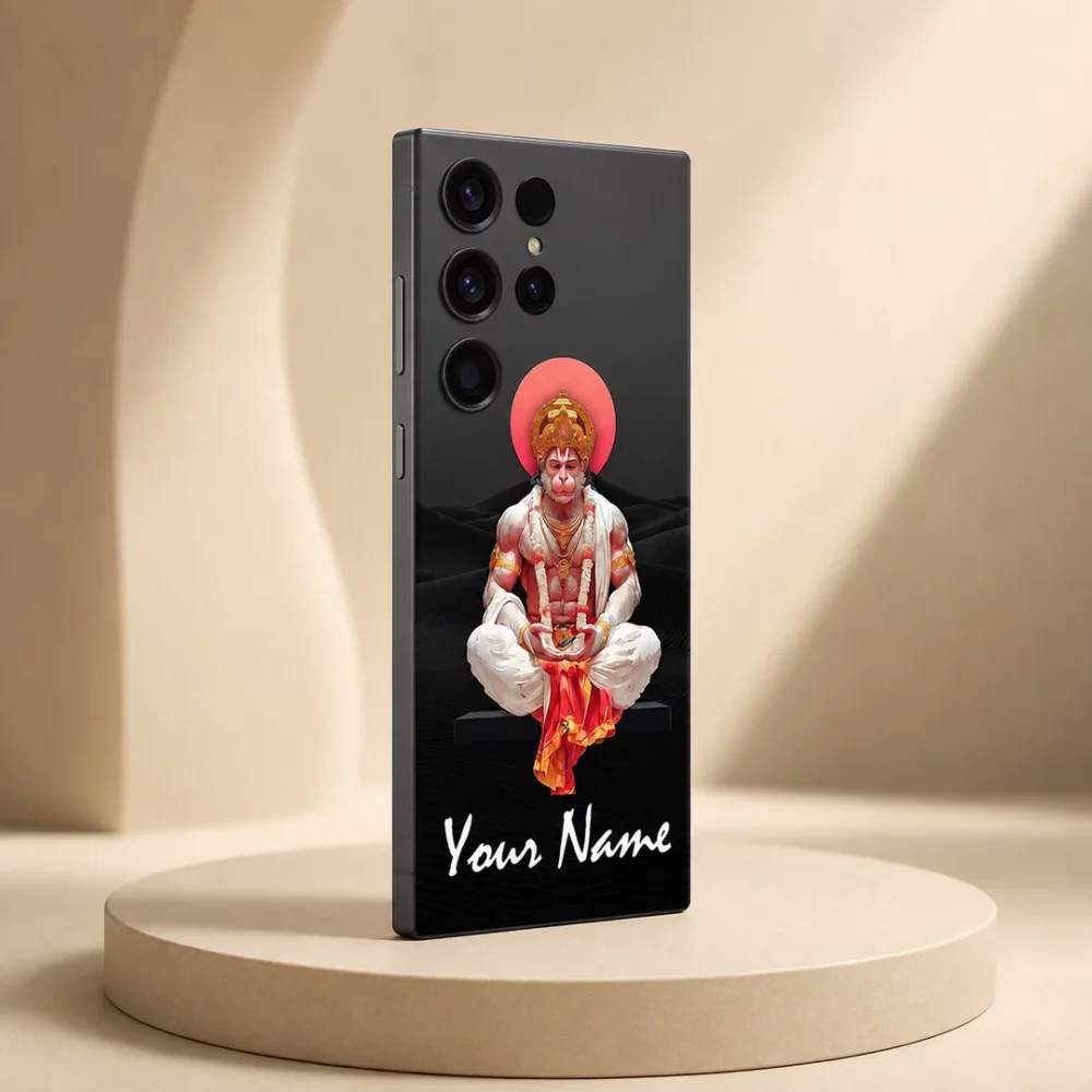Lord Hanumanji Custom Name Mobile Skin — angled view showing meditating Hanumanji in white and red garments with gold crown, red halo and white sample name