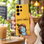 Lord Krishna floral custom name mobile skin held in a bright cafe