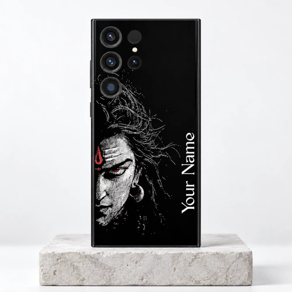Mahadev custom name mobile skin with white Shiva half-face and vertical Your Name sample on a pale stone pedestal