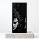 Mahadev custom name mobile skin with white Shiva half-face and vertical Your Name sample on a pale stone pedestal