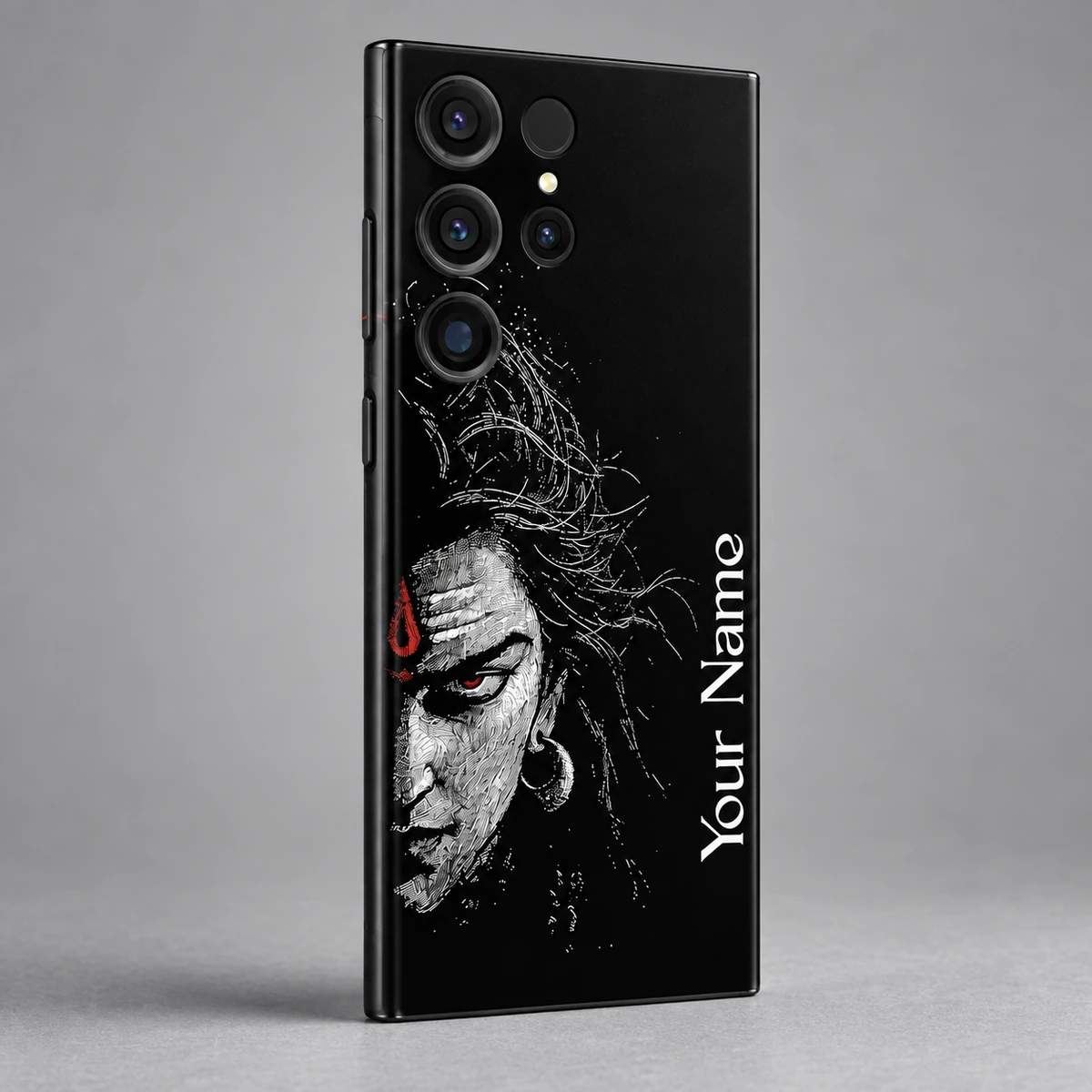 Mahadev Half Face Custom Name Mobile Skin - Name detail Close view of white Shiva half-face and vertical Your Name lettering on black mobile skin