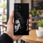Mahadev custom name mobile skin held in hand in a modern cafe