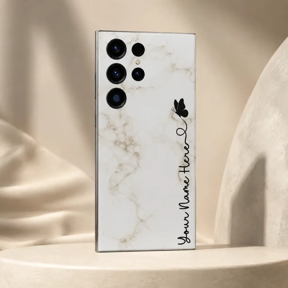 White Marble Butterfly Custom Name Mobile Skin — angled view showing white marble with a black butterfly and vertical cursive personalised name
