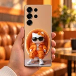 Orange Streetwear Cat Mobile Skin in-hand lifestyle view